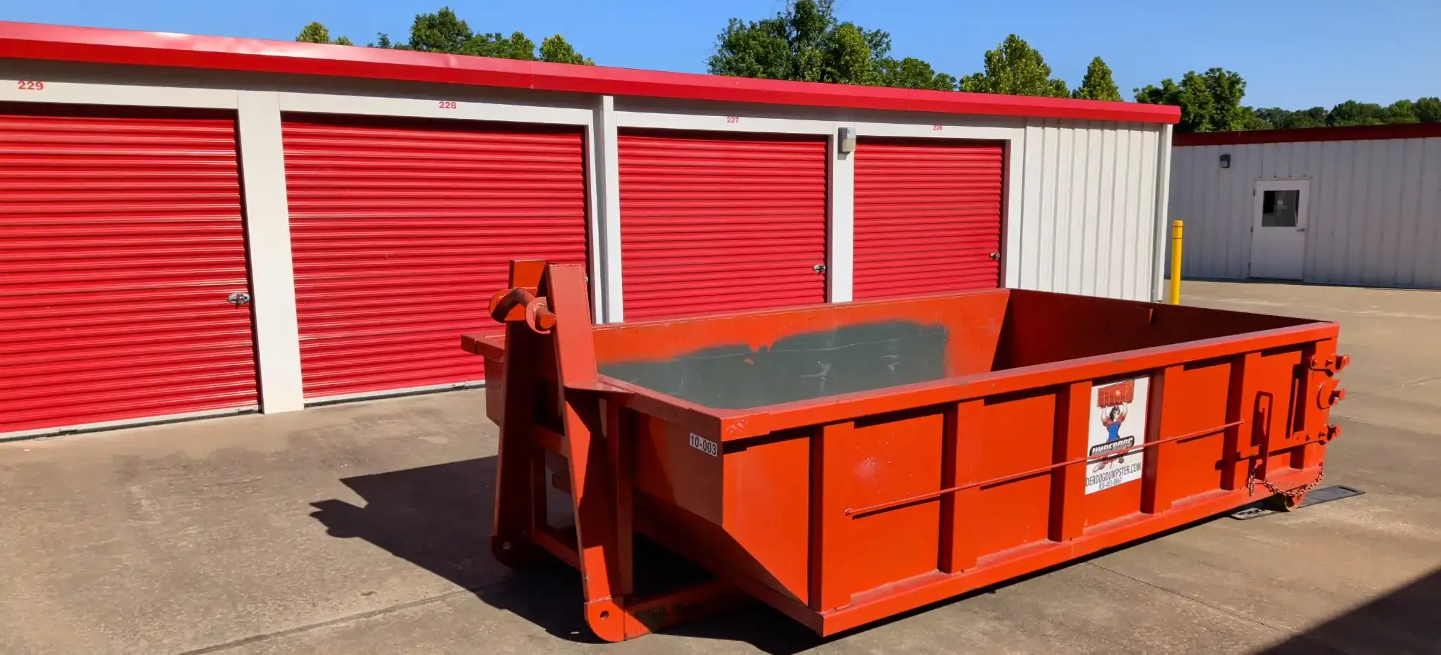 Underdog Dumpster roll-off container set down on the lot at a Clarksville commercial storage facility